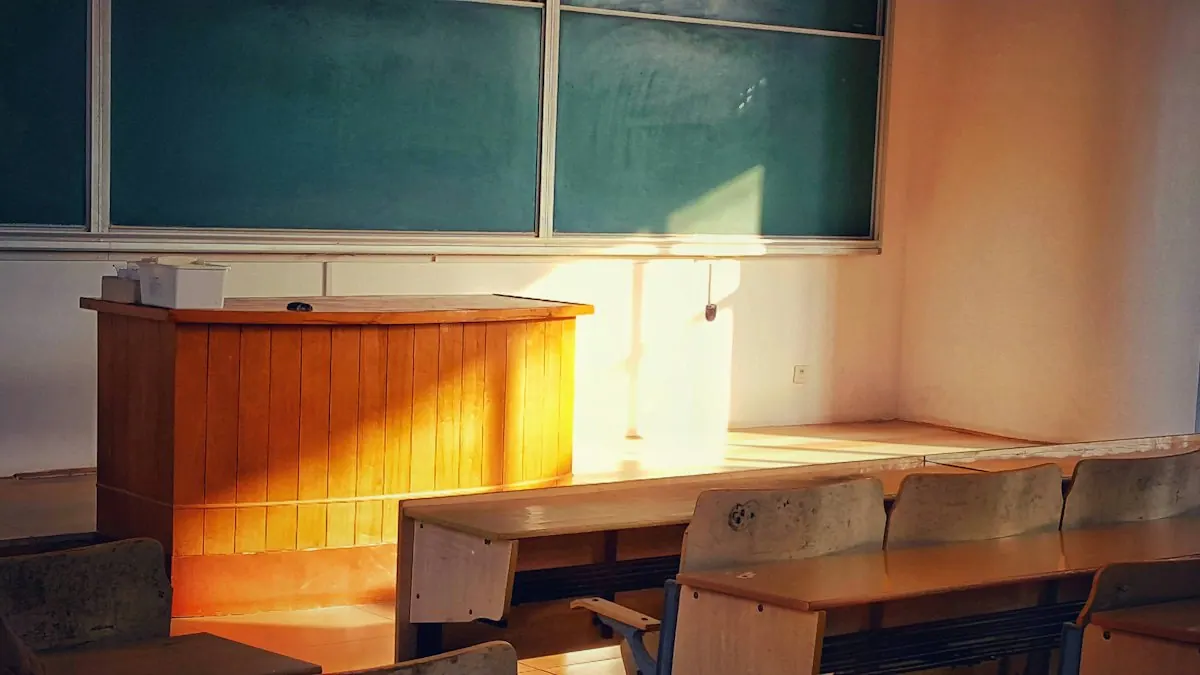 Desks and a blackboard in a sunlit classroom